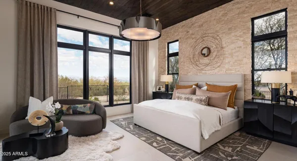 a bedroom with a bed and a couch