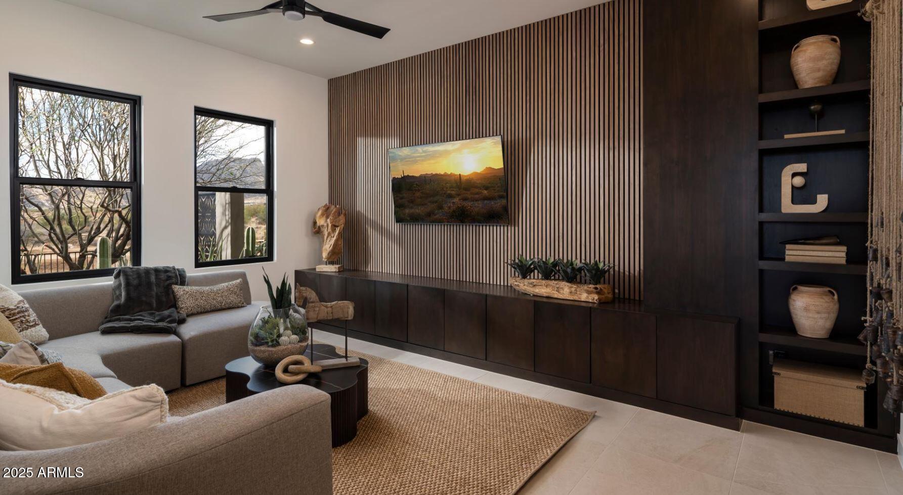12602 East Chama Road, Unit 603 Scottsdale, AZ 85255 - Photo 8 of 11 a living room with furniture and a flat screen tv