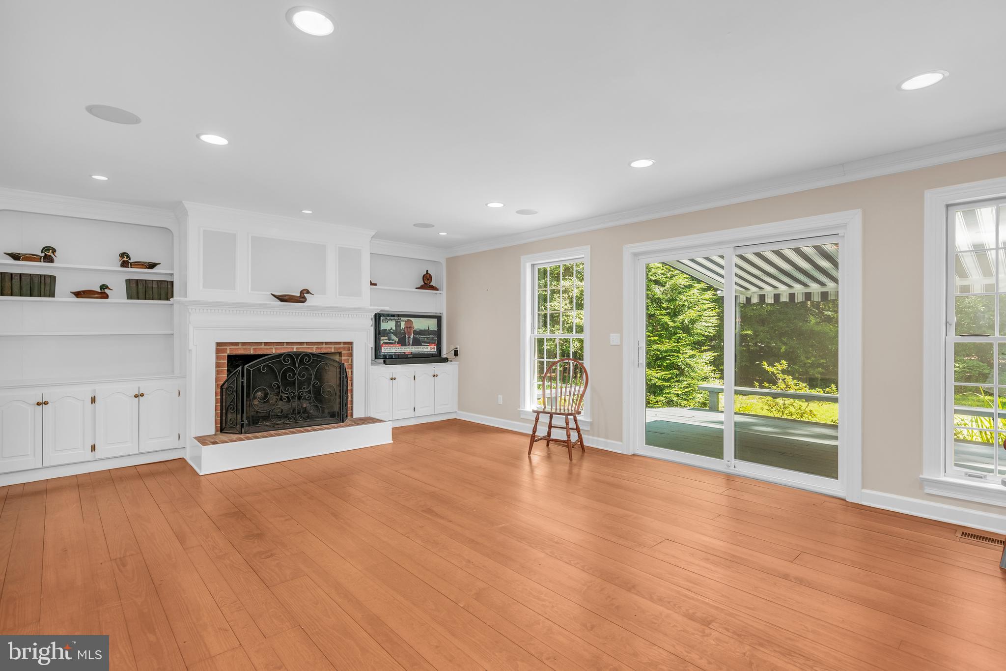 24420 Mallard Place St. Michaels, MD 21663 - Photo 12 of 33 a view of an empty room with a fireplace and a window