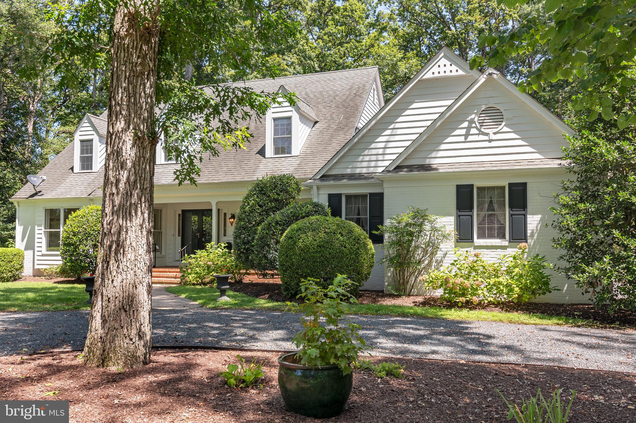 24420 Mallard Place St. Michaels, MD 21663 - Photo 2 of 33 a front view of a house with garden