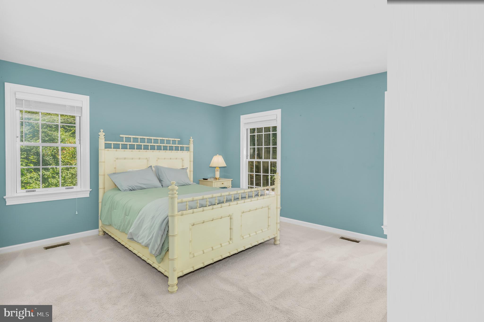 24420 Mallard Place St. Michaels, MD 21663 - Photo 23 of 33 a bed sitting in a bedroom next to a window