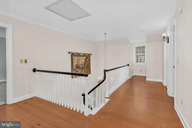a view of an entryway with wooden floor