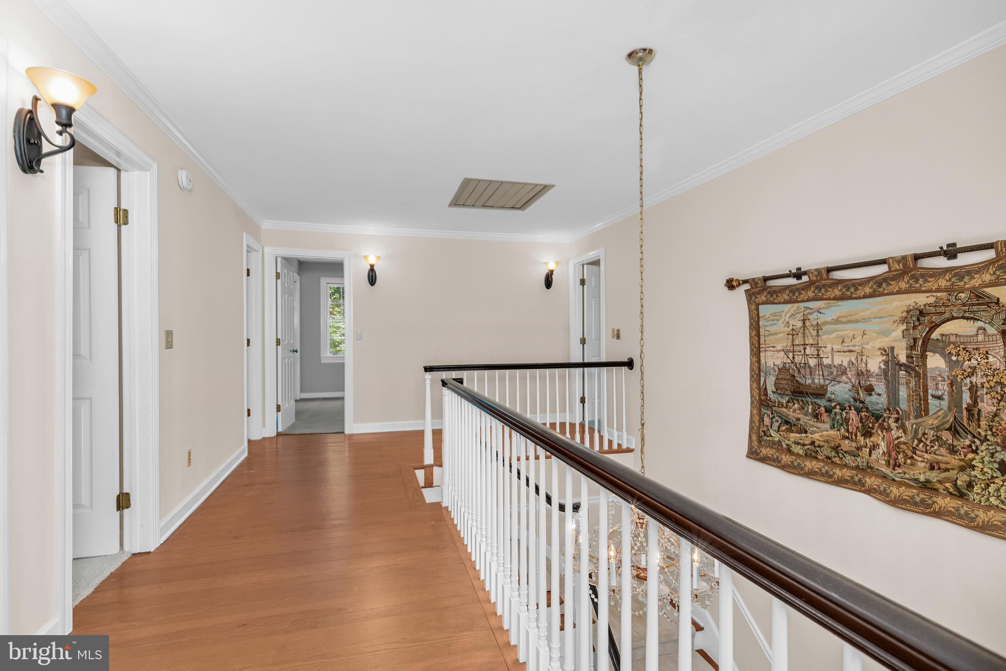 24420 Mallard Place St. Michaels, MD 21663 - Photo 28 of 33 a view of a hallway with wooden floor and staircase