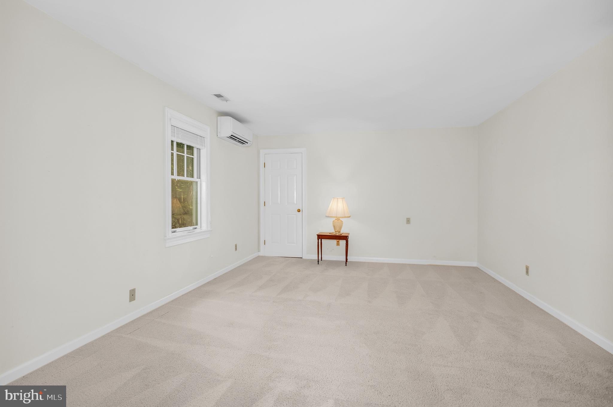 24420 Mallard Place St. Michaels, MD 21663 - Photo 30 of 33 an empty room with windows and cabinet