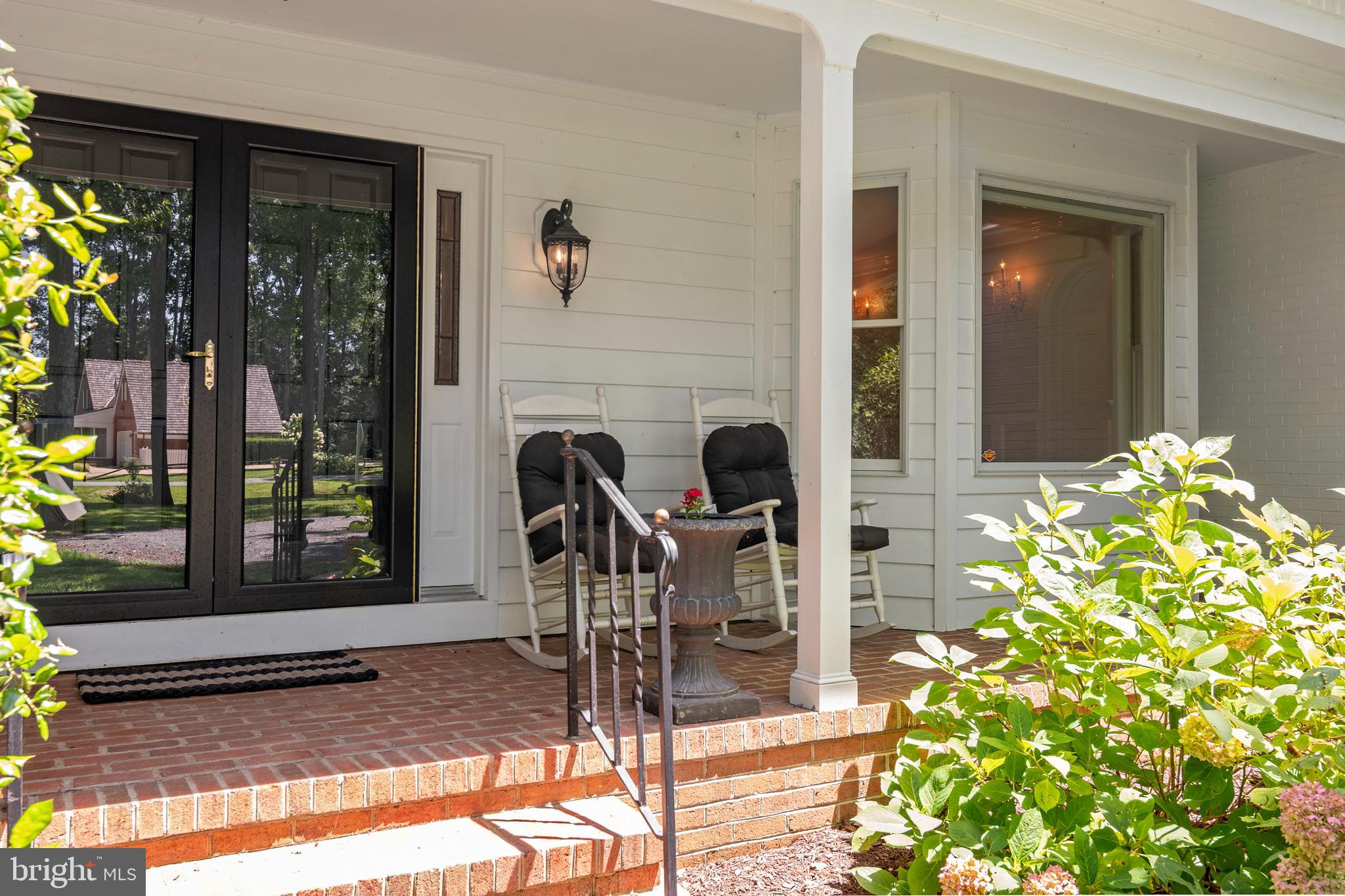 24420 Mallard Place St. Michaels, MD 21663 - Photo 6 of 33 a front view of a house with garden