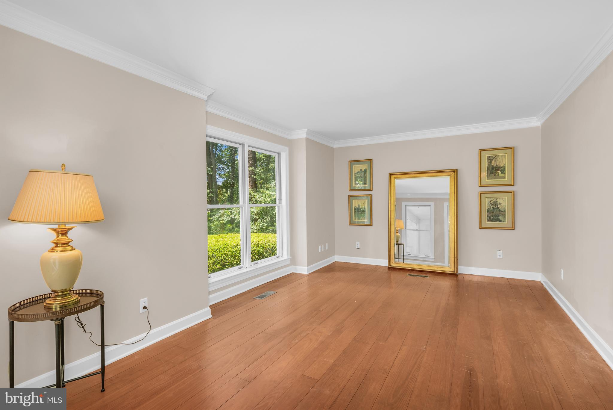 24420 Mallard Place St. Michaels, MD 21663 - Photo 9 of 33 a view of an empty room with window and wooden floor