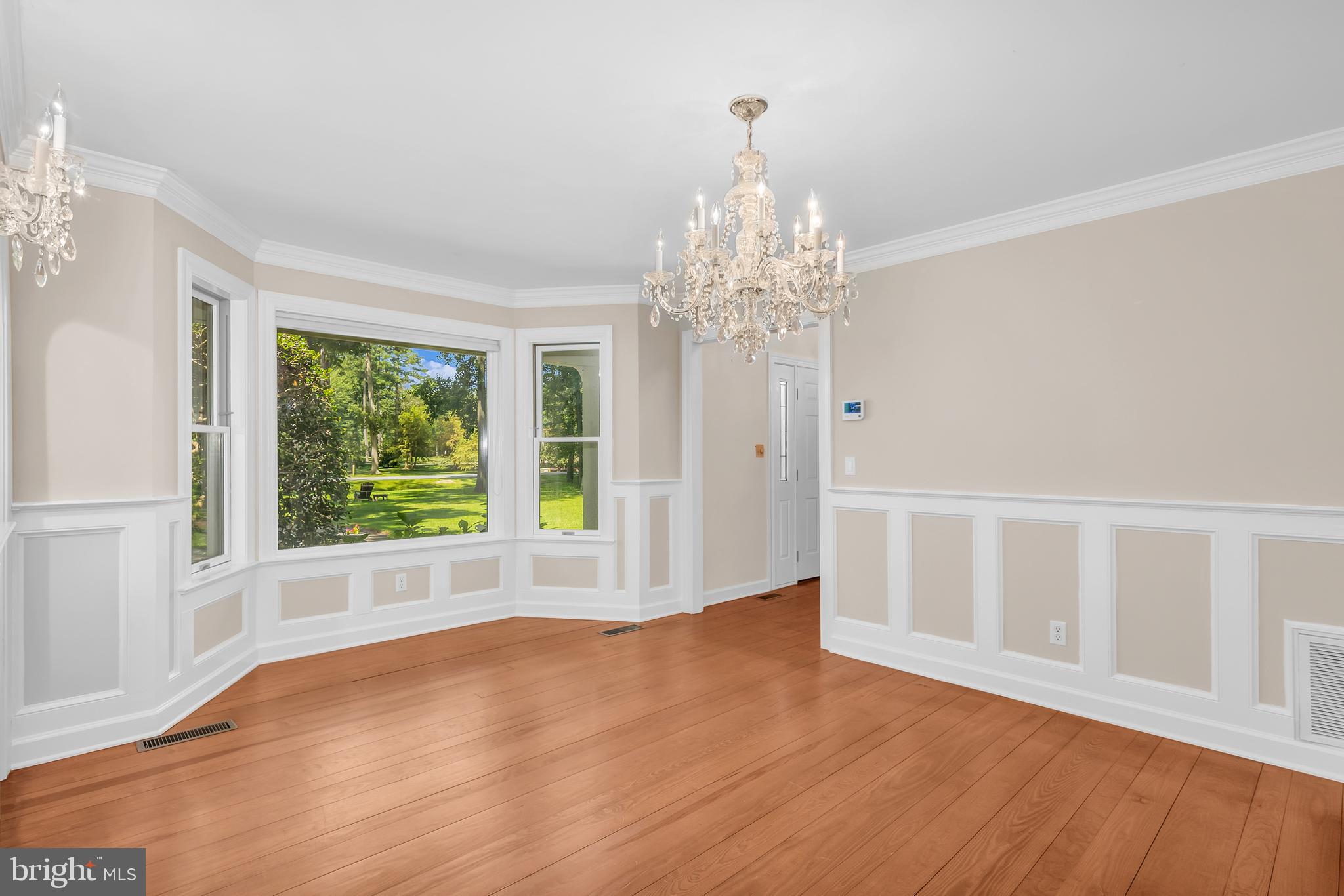 24420 Mallard Place St. Michaels, MD 21663 - Photo 10 of 33 a view of an empty room with wooden floor and a window