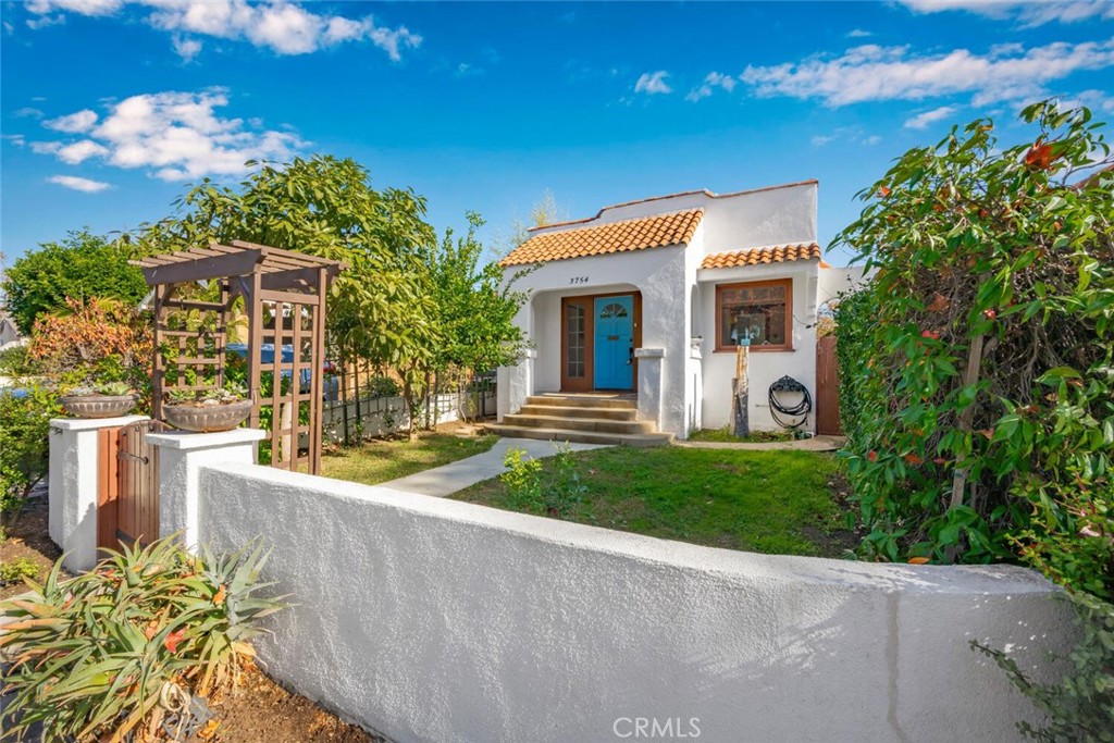 3754 Brayton Avenue Long Beach, CA 90807 - Photo 2 of 33 a front view of a house with a yard