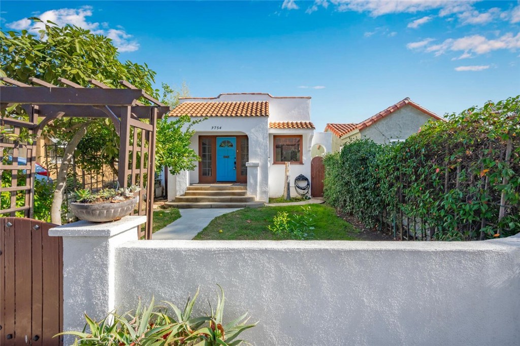 3754 Brayton Avenue Long Beach, CA 90807 - Photo 3 of 33 a front view of a house with garden