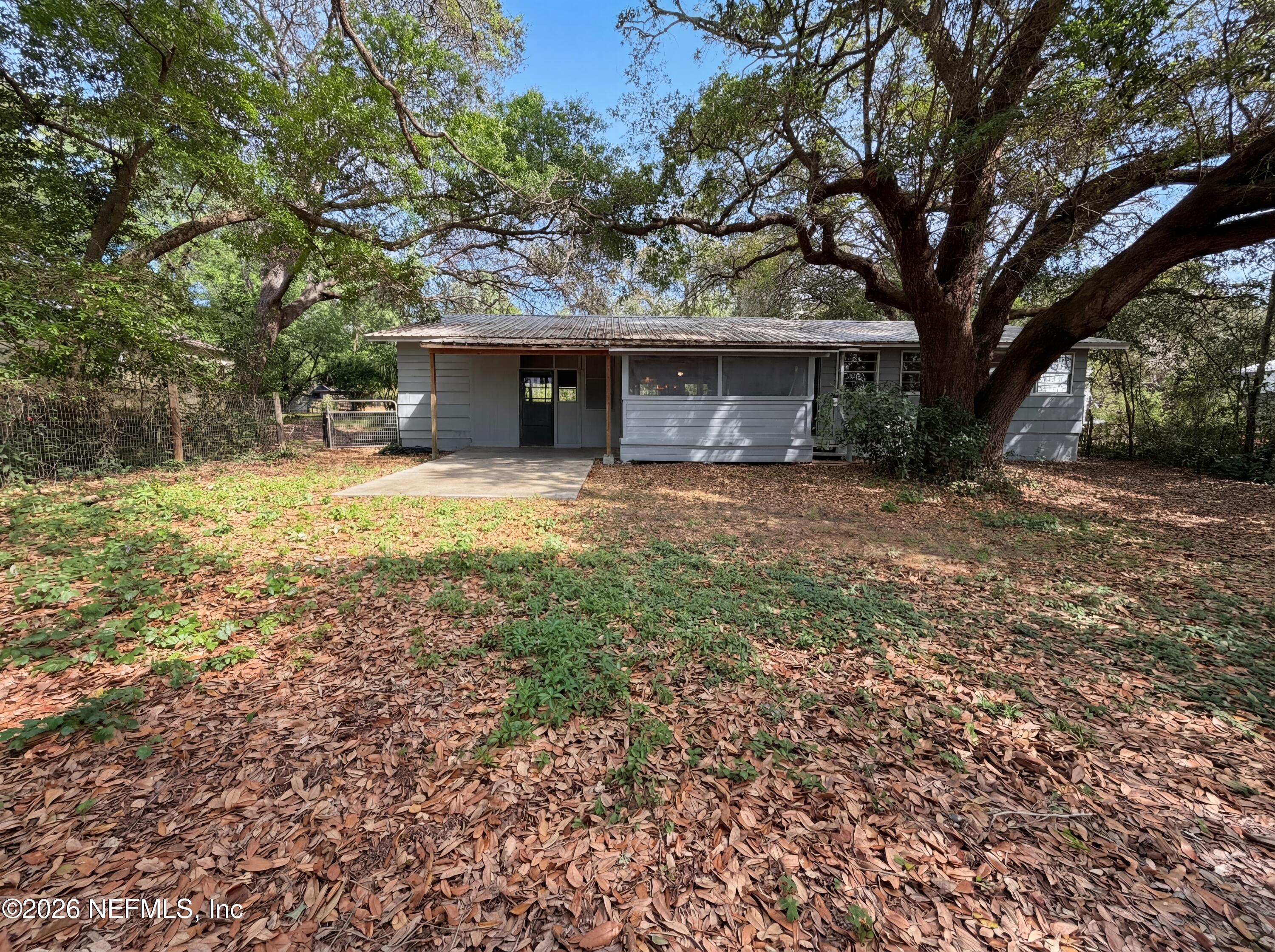 6917 Gatorbone Road Keystone Heights, FL 32656 - Photo 23 of 24 a view of a house with a yard