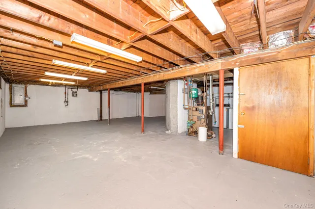 a view of a room with wooden walls