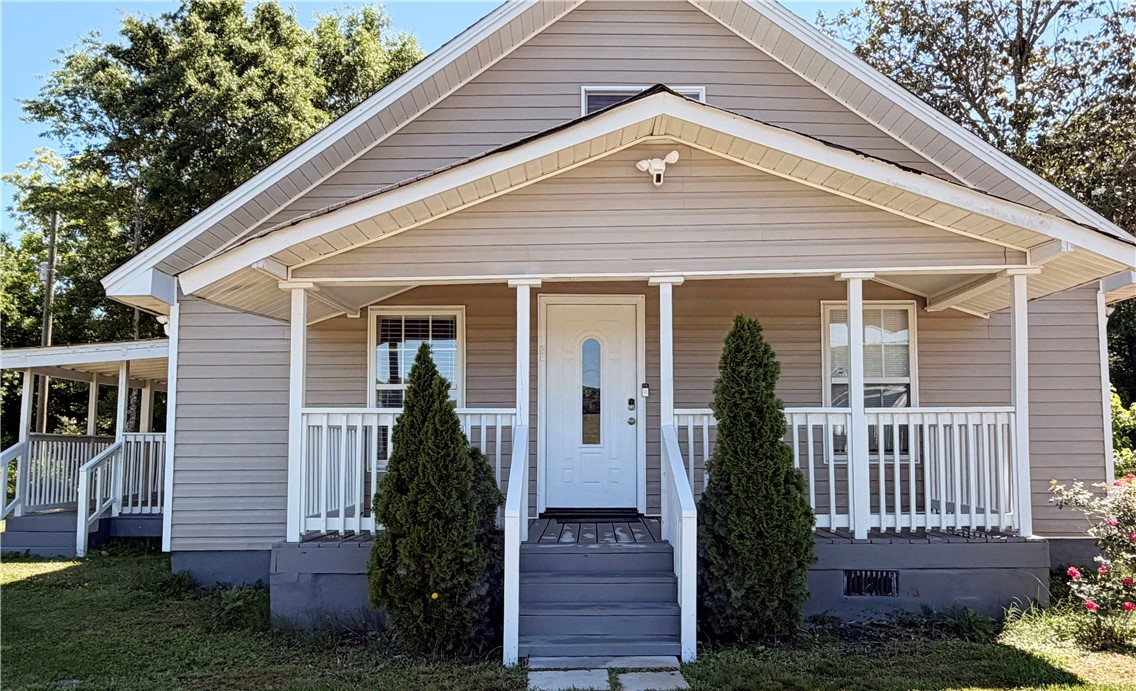 358 Finley Road Easley, SC 29642 - Photo 3 of 20 This charming home offers a welcoming facade with a cozy covered porch, perfect for relaxation.