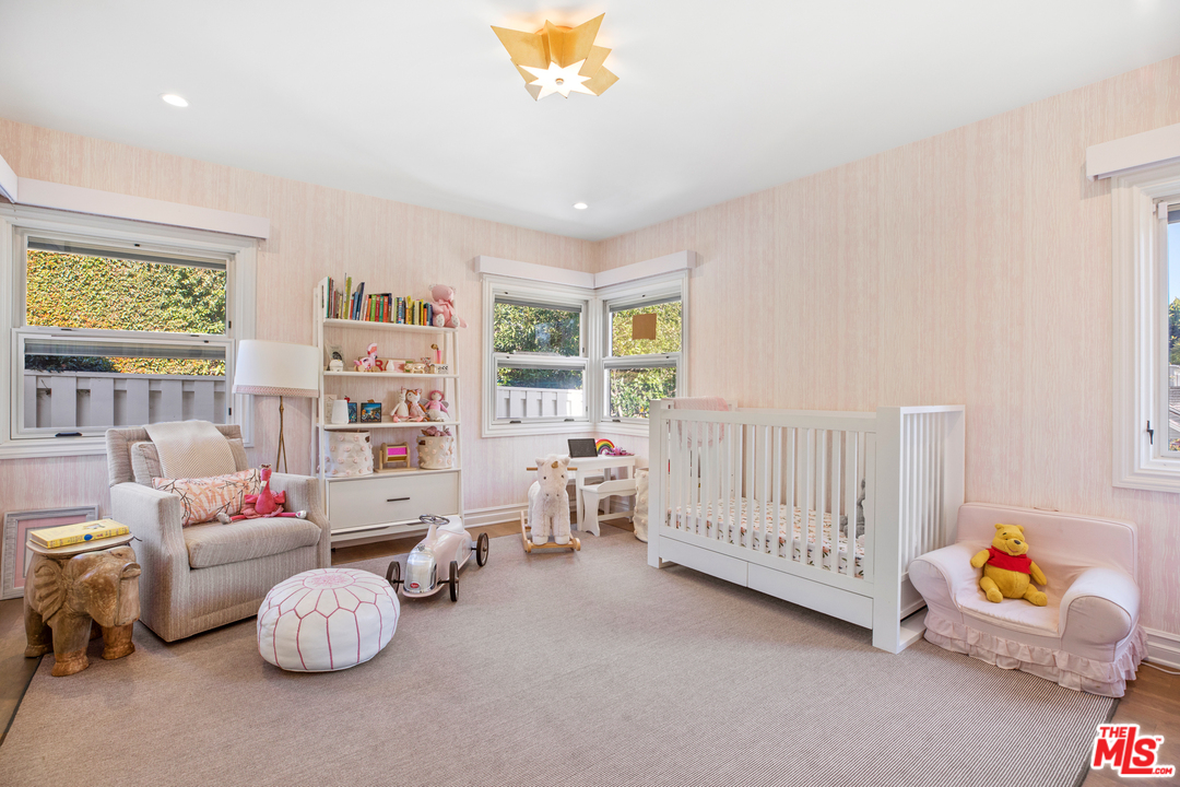 384 Dalkeith Avenue Los Angeles, CA 90049 - Photo 23 of 37 a bedroom with furniture toys and a book shelf