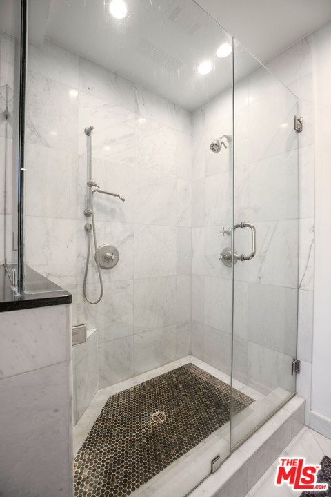 384 Dalkeith Avenue Los Angeles, CA 90049 - Photo 31 of 37 a bathroom with a shower