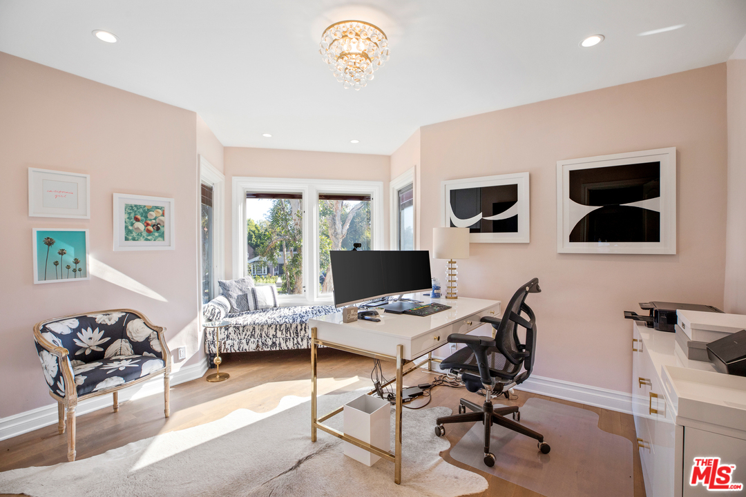 384 Dalkeith Avenue Los Angeles, CA 90049 - Photo 33 of 37 a workspace with a flat screen tv and a window