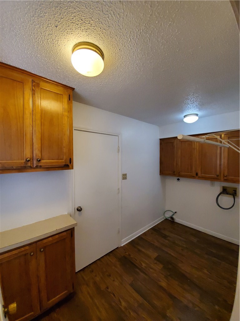 108 Verna Spur, Unit B Georgetown, TX 78628 - Photo 23 of 24 Now we're back downstairs - OVERSIZED Utility Room with Tons of Cabinets!