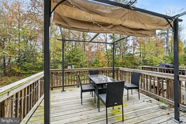 a view of a balcony with wooden floor