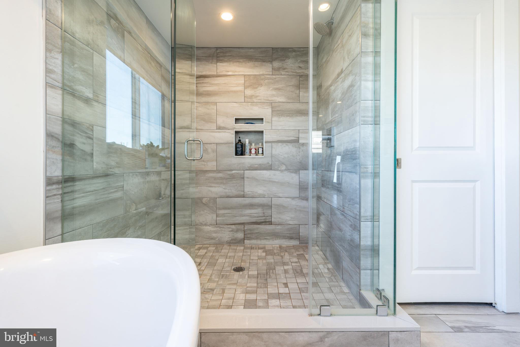 1647 East Eyre Street, Unit 8 Philadelphia, PA 19125 - Photo 19 of 28 Sleek modern shower with elegant tile work.