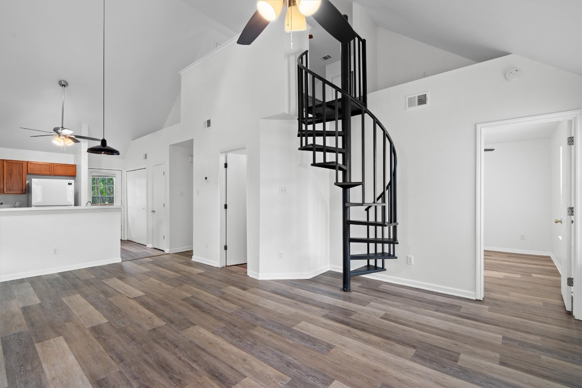 2908 Whisper Oaks Lane, Unit C Georgetown, TX 78628 - Photo 2 of 31 a view of empty room with wooden floor and fan