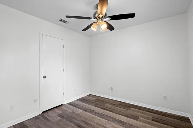 a view of room with window and ceiling fan