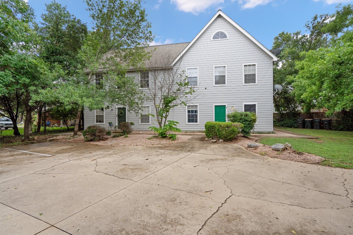 2908 Whisper Oaks Lane, Unit C Georgetown, TX 78628 - Photo 4 of 31 a front view of a house with a yard
