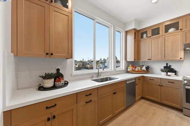a kitchen with a sink and cabinets