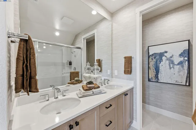 a bathroom with a double vanity sink mirror and double