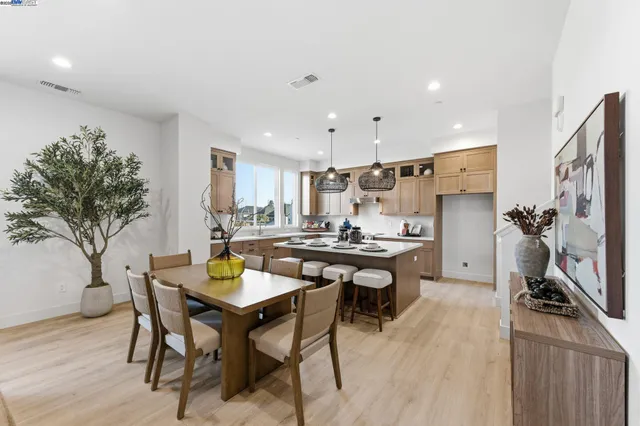 a kitchen with a table and chairs in it