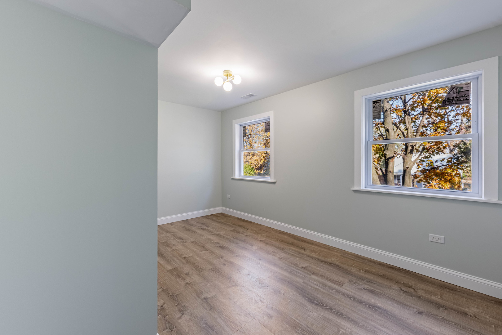 1817 Kelly Avenue Crest Hill, IL 60403 - Photo 15 of 22 an empty room with wooden floor and window