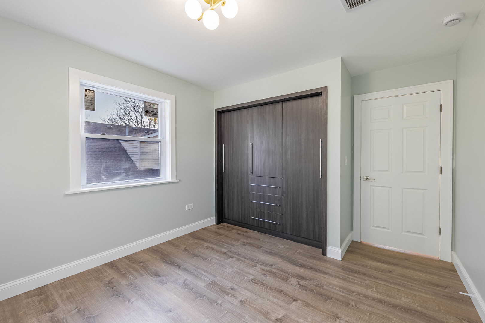1817 Kelly Avenue Crest Hill, IL 60403 - Photo 16 of 22 an empty room with windows and closet