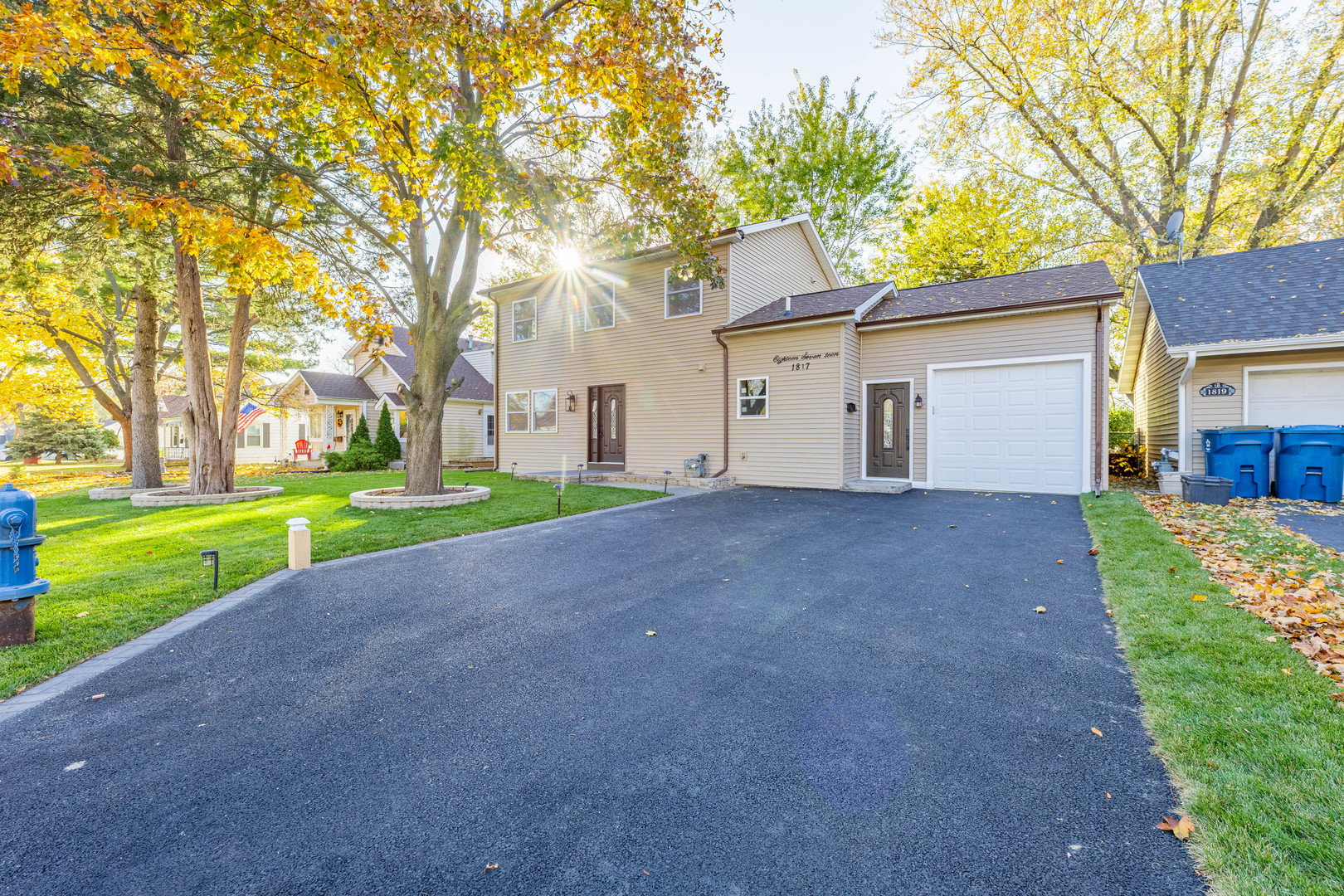 1817 Kelly Avenue Crest Hill, IL 60403 - Photo 2 of 22 a view of a house with a yard and large tree