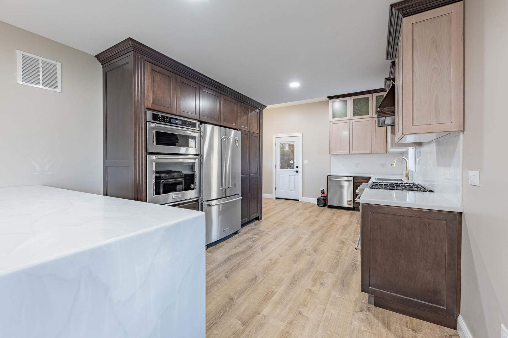 1817 Kelly Avenue Crest Hill, IL 60403 - Photo 6 of 22 a kitchen with granite countertop a refrigerator and a stove top oven