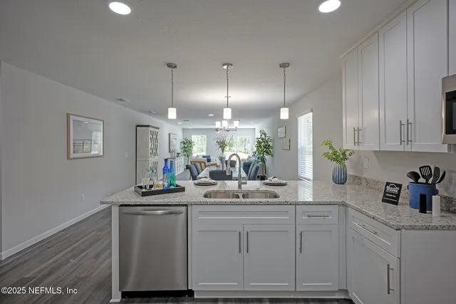 an empty room with wooden floor and a window