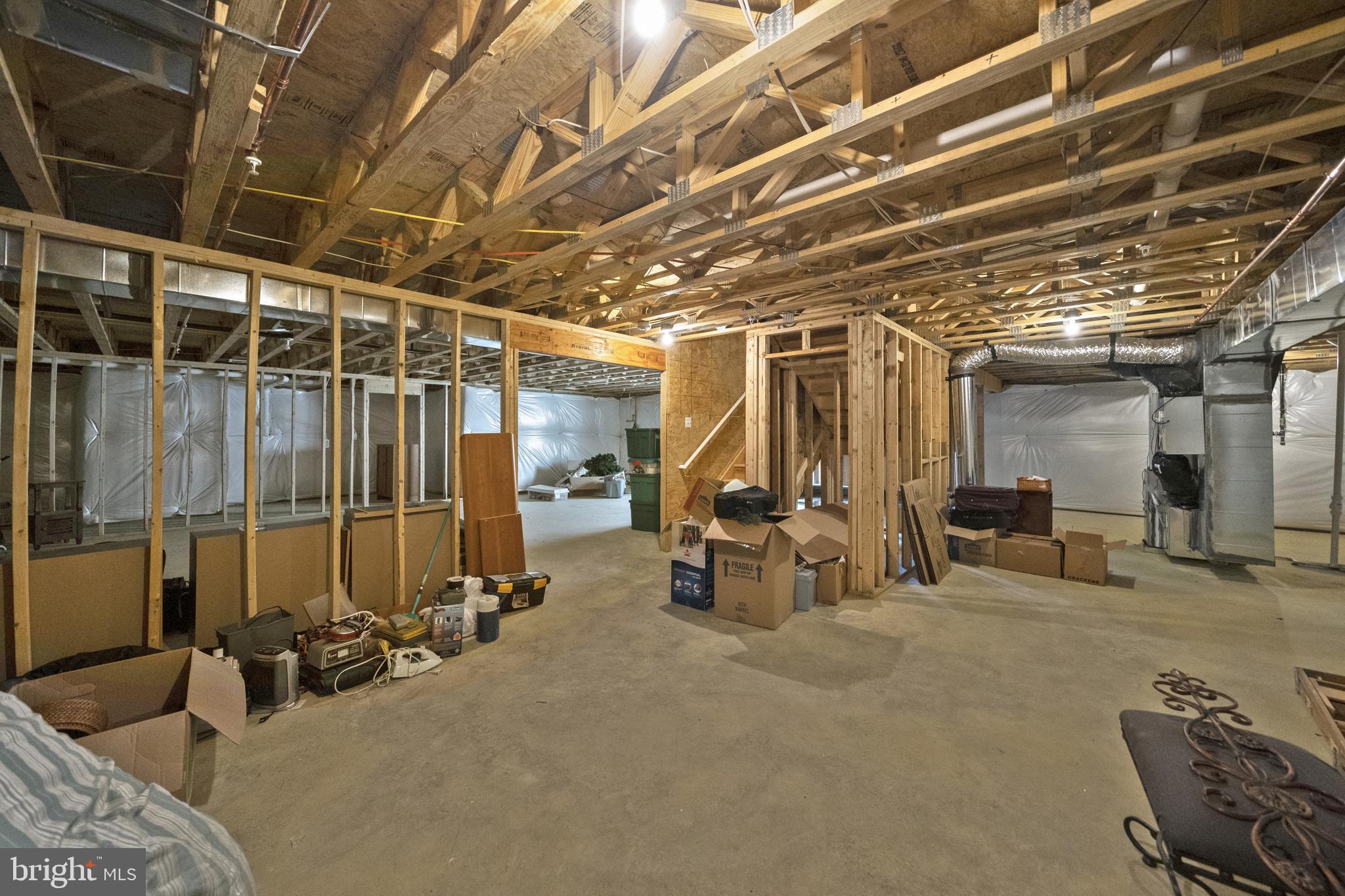 13896 Ensign Road Solomons, MD 20688 - Photo 19 of 27 unfinished Basement with 3 Piece Rough In