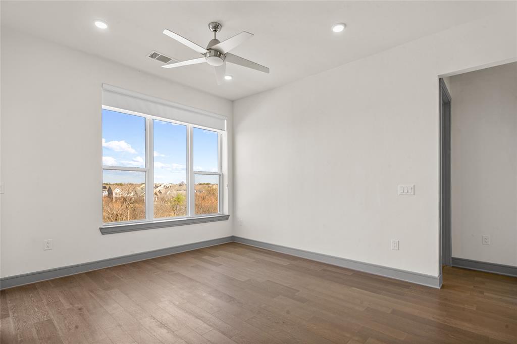 2700 Old Denton Road, Unit 3318 Carrollton, TX 75007 - Photo 6 of 24 Living room with the view of lush greenbelt