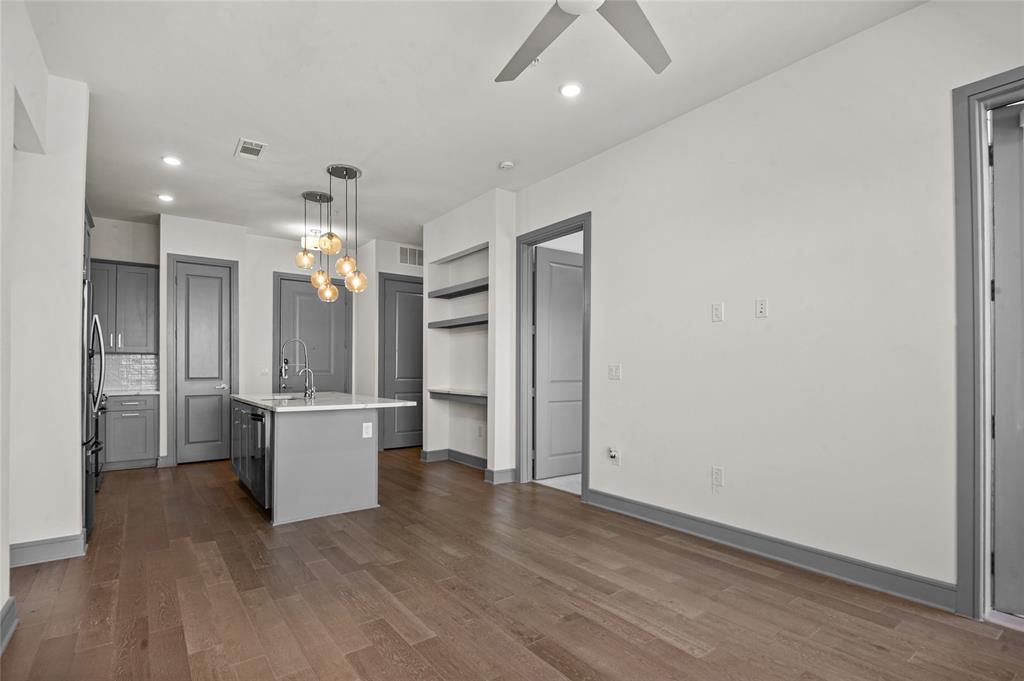 2700 Old Denton Road, Unit 3318 Carrollton, TX 75007 - Photo 7 of 24 Open concept kitchen with living room view