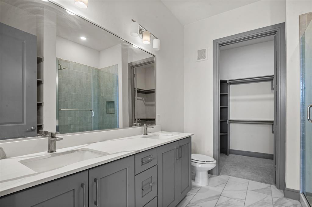 2700 Old Denton Road, Unit 3318 Carrollton, TX 75007 - Photo 10 of 24 Full bath with a spacious closet, double vanity, and a shower stall