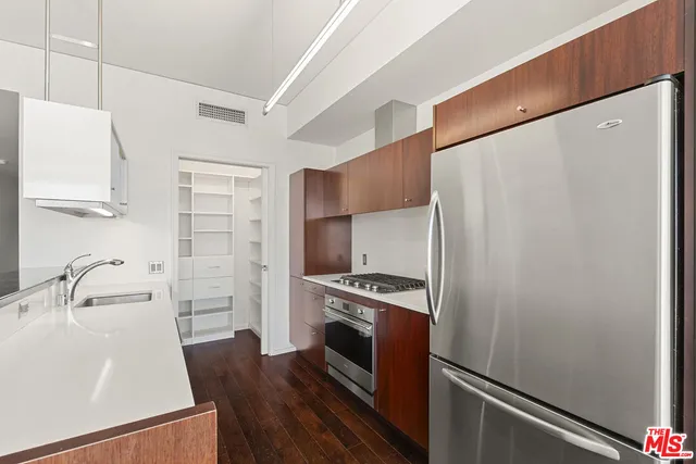 a kitchen with a sink and a microwave