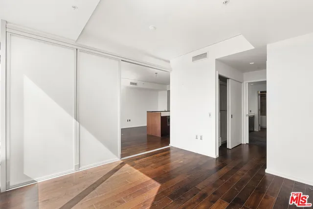 a bathroom with a double vanity sink a mirror and a shower