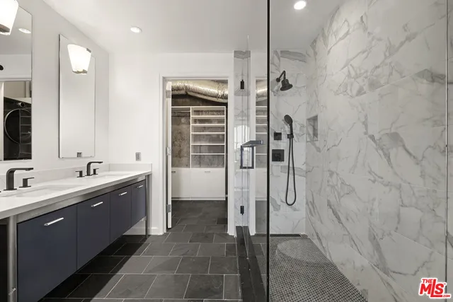 a view of a hallway with washer and dryer