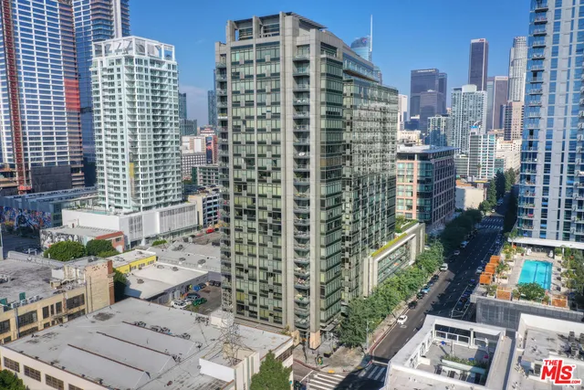 a view of entryway with a rug and wooden floor