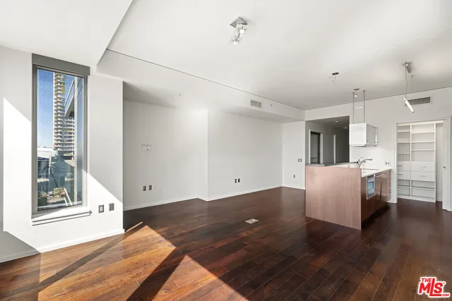a view of kitchen with furniture and wooden floor