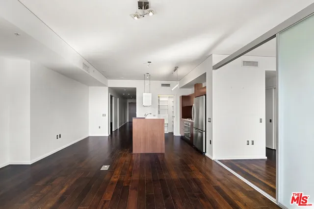 a kitchen with stainless steel appliances a refrigerator and a sink