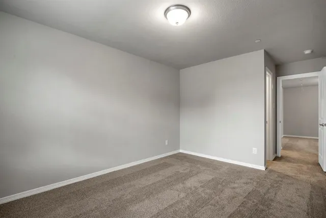 an empty room with closet area