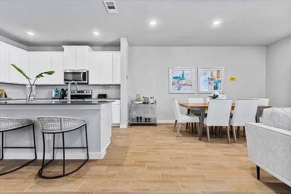 a dining room with furniture and window