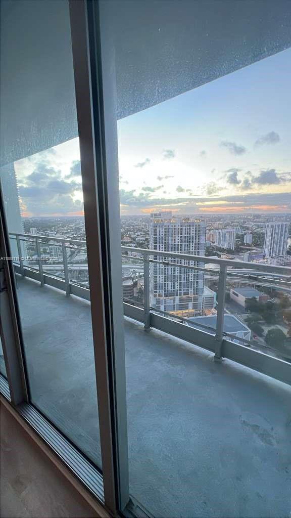 90 Southwest 3rd Street, Unit 4208 Miami, FL 33130 - Photo 12 of 17 a view of a floor to ceiling window and an empty room