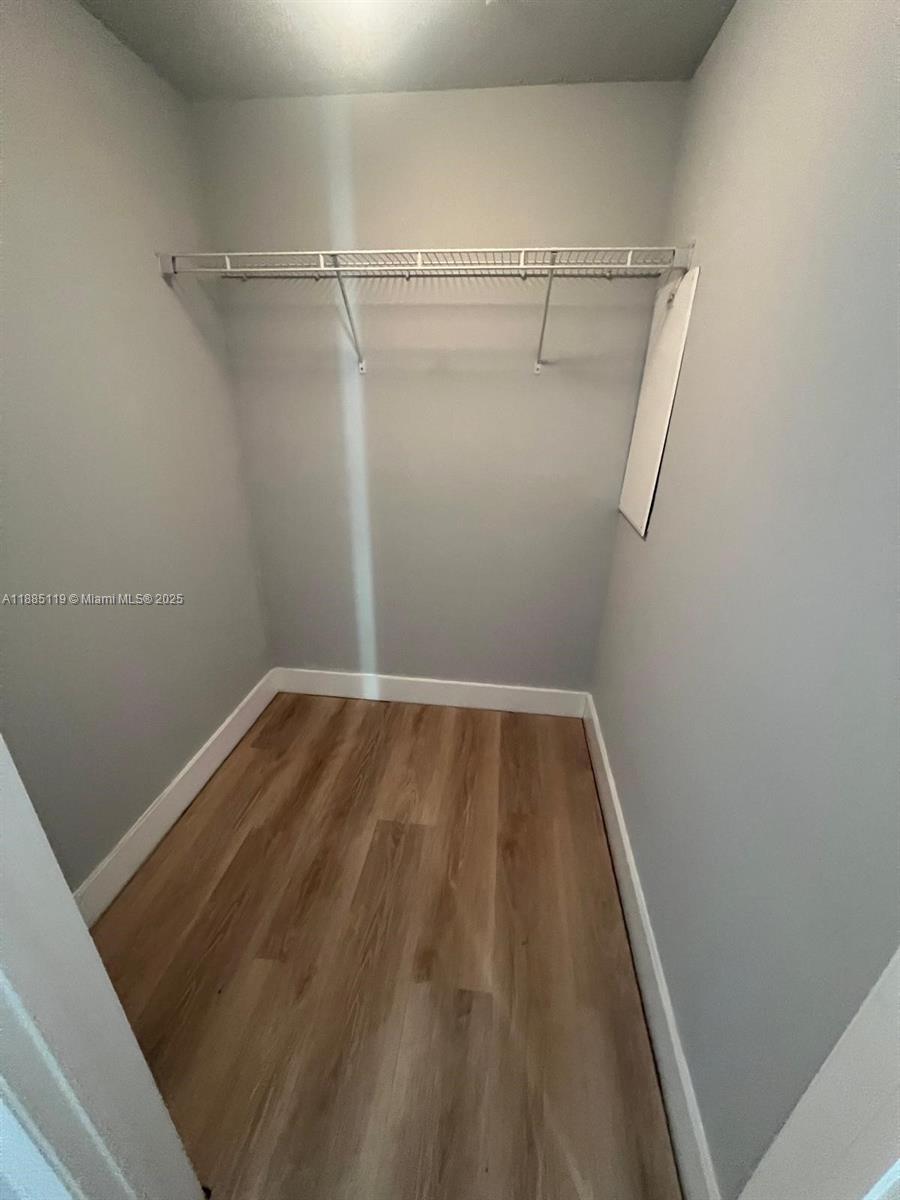 90 Southwest 3rd Street, Unit 4208 Miami, FL 33130 - Photo 14 of 17 a view of small space with racks on the wall