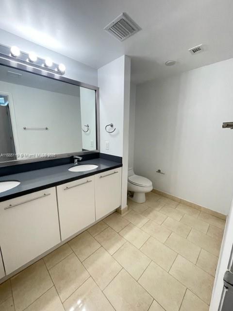 90 Southwest 3rd Street, Unit 4208 Miami, FL 33130 - Photo 4 of 17 a kitchen with a sink and cabinets