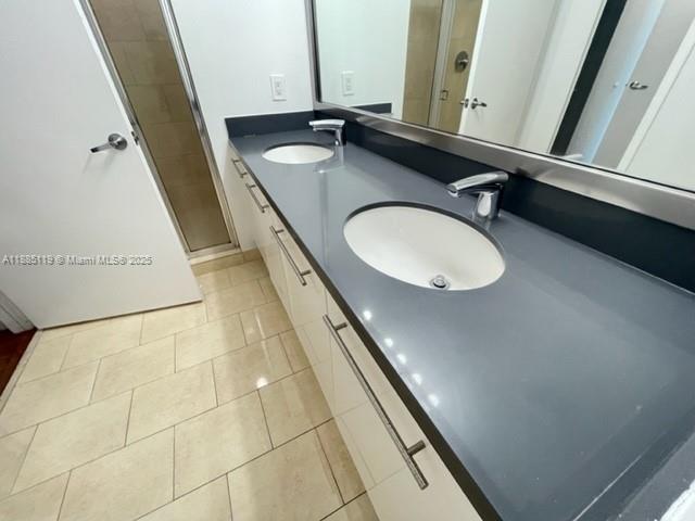 90 Southwest 3rd Street, Unit 4208 Miami, FL 33130 - Photo 5 of 17 a bathroom with a sink and a mirror