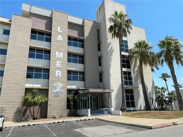 a view of a building with a tree